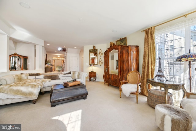 living room featuring light carpet and recessed lighting