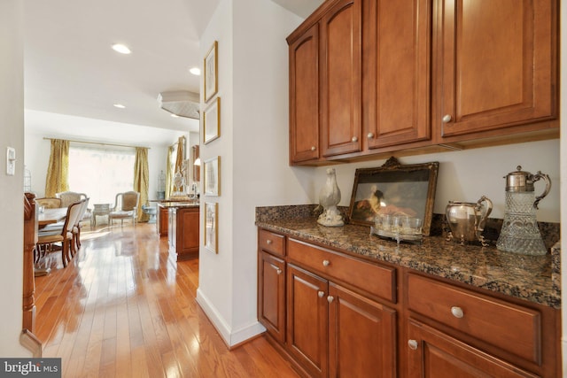 bar with light wood-style floors, baseboards, and recessed lighting