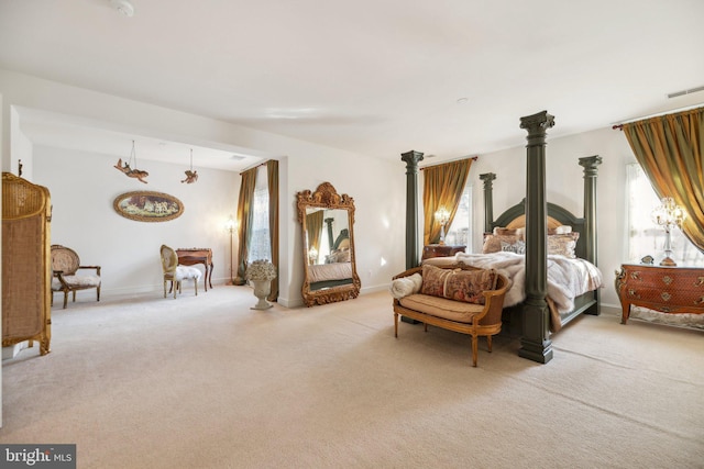 bedroom featuring light carpet, baseboards, and visible vents