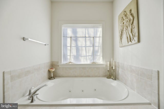 full bathroom featuring a jetted tub