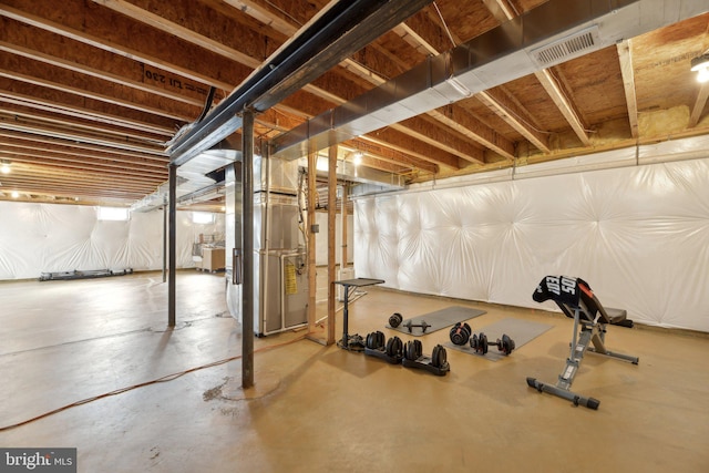 workout area with visible vents and heating unit