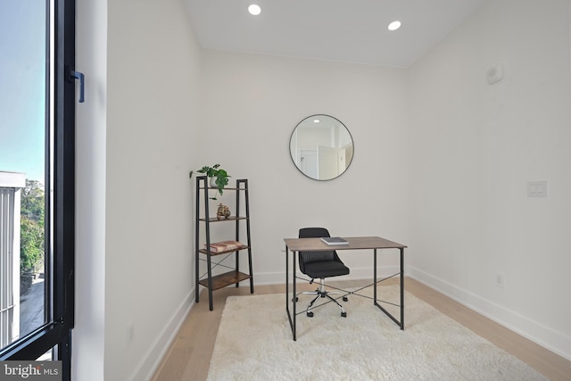 home office with light wood-style floors, baseboards, and recessed lighting