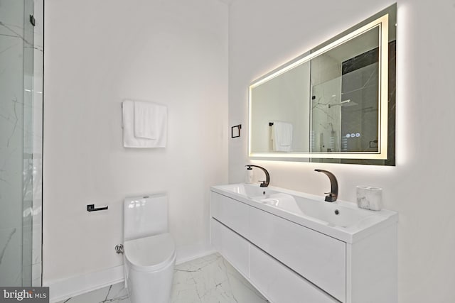 full bath featuring marble finish floor, double vanity, toilet, a sink, and baseboards