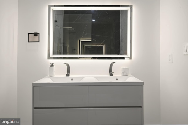 full bath featuring a sink and double vanity