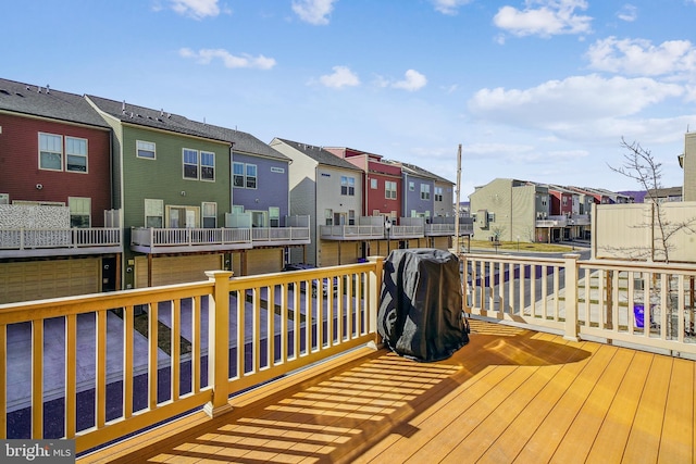 wooden deck with a residential view