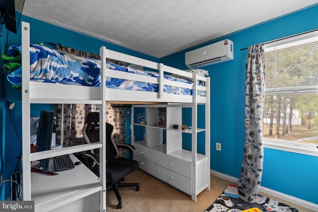 bedroom with a textured ceiling, baseboards, an AC wall unit, and light colored carpet