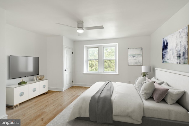 bedroom with ceiling fan, baseboards, and light wood-style floors