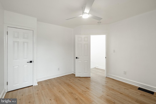 unfurnished bedroom featuring visible vents, ceiling fan, light wood-style flooring, and baseboards