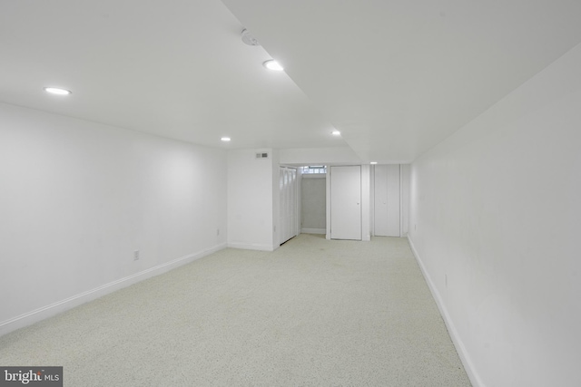 finished basement with recessed lighting, visible vents, and baseboards