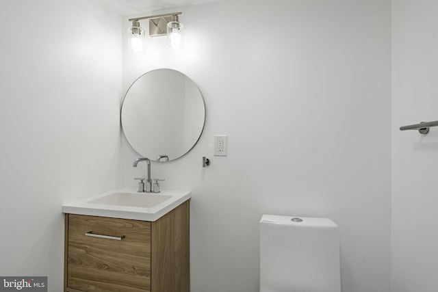 bathroom with toilet and vanity