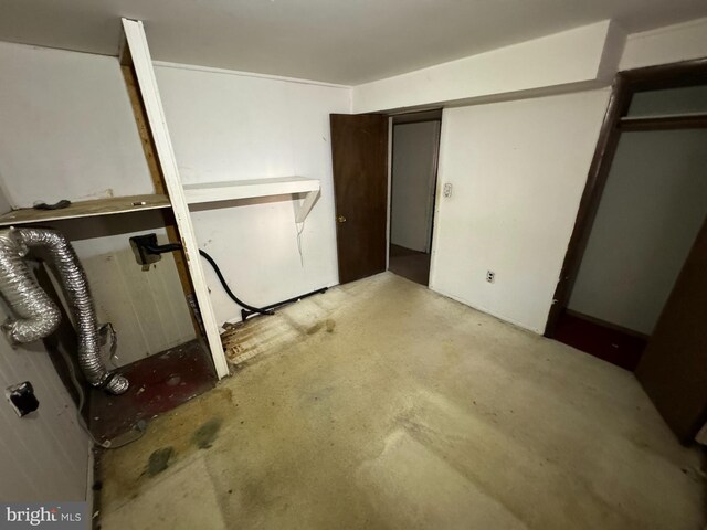 8267 Old Mill Rd, Pasadena, MD 21122 - unfurnished bedroom featuring unfinished concrete flooring