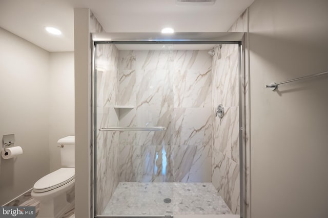 full bathroom with toilet and a marble finish shower