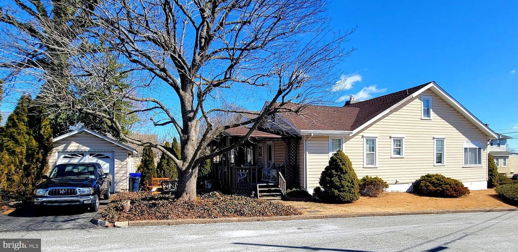 view of home's exterior featuring an outbuilding