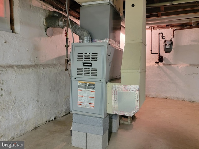 utility room with heating unit