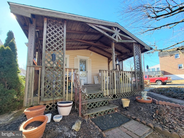 view of exterior entry with a porch