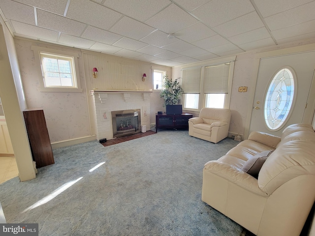 unfurnished living room featuring carpet and a fireplace