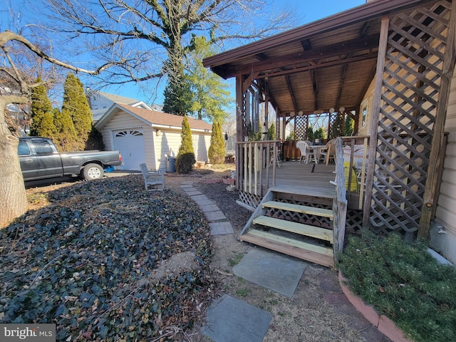 exterior space with a wooden deck and an outbuilding
