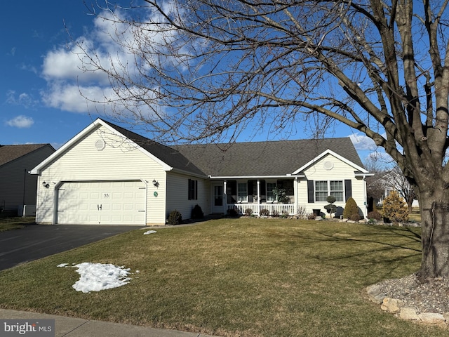 ranch-style house with a garage, a porch, a front lawn, and aphalt driveway