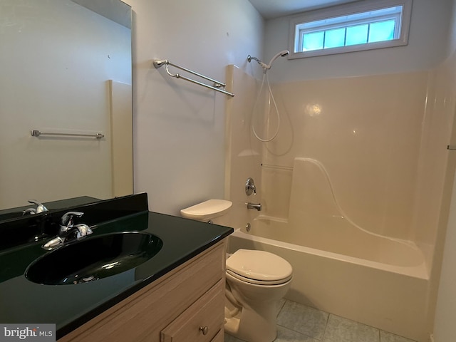 full bathroom featuring tub / shower combination, vanity, toilet, and tile patterned floors