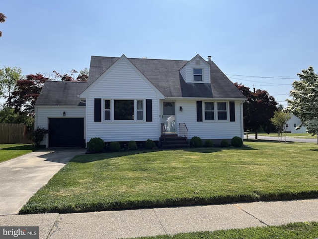 cape cod home featuring an attached garage, a front lawn, and concrete driveway