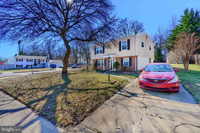 colonial home featuring brick siding and a front yard