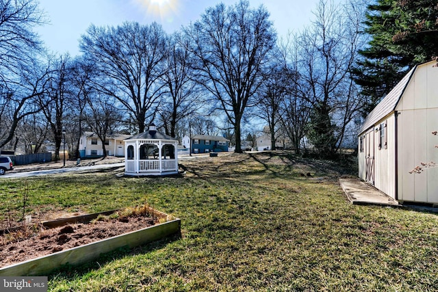 view of yard featuring an outdoor structure and a gazebo