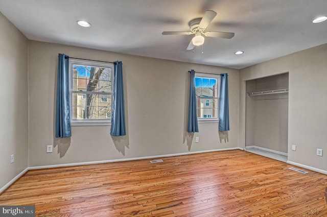 unfurnished bedroom featuring light wood finished floors, recessed lighting, visible vents, and baseboards