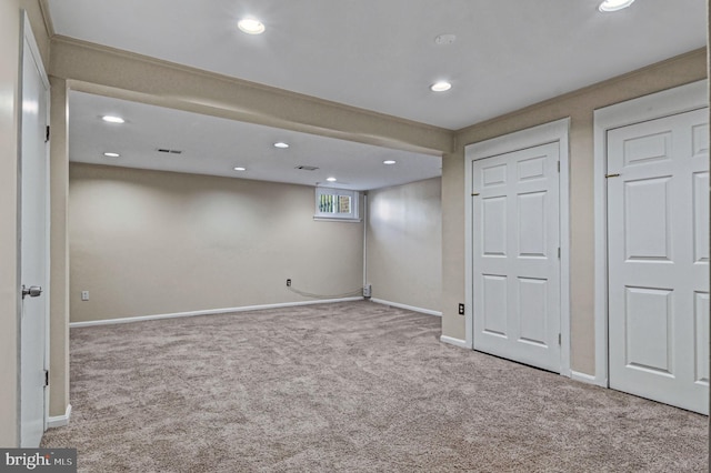 basement featuring baseboards, carpet flooring, and recessed lighting