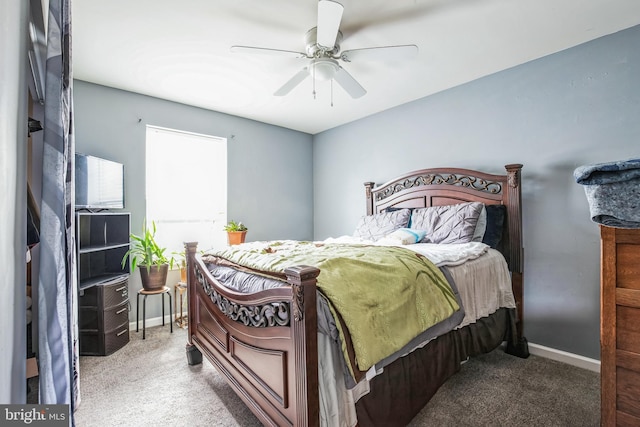 bedroom with carpet floors, a ceiling fan, and baseboards