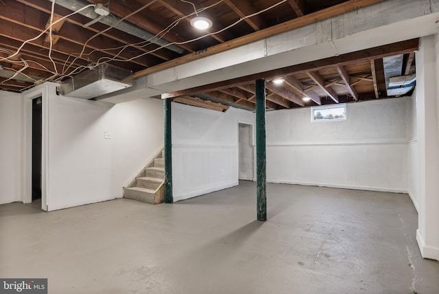 basement featuring stairs