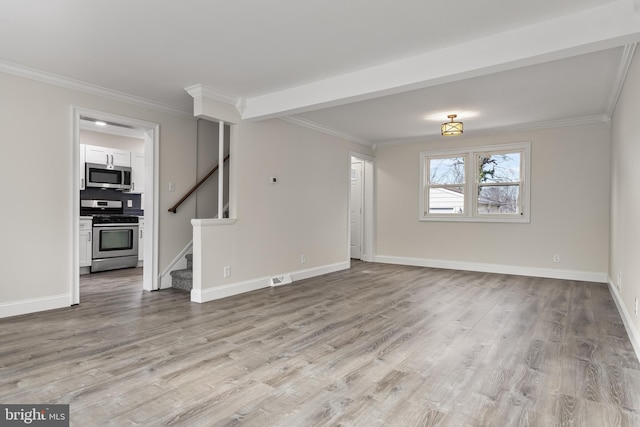 unfurnished living room with stairs, light wood finished floors, ornamental molding, and baseboards