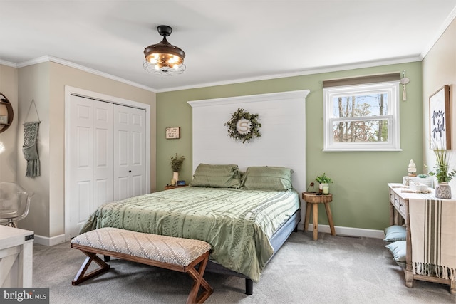 bedroom featuring baseboards, ornamental molding, a closet, and light colored carpet