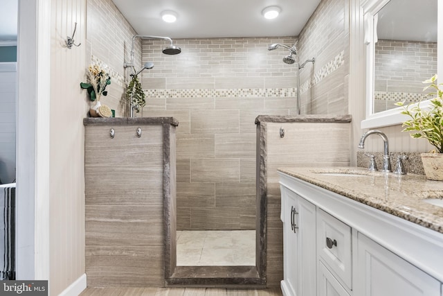 bathroom with vanity and a walk in shower