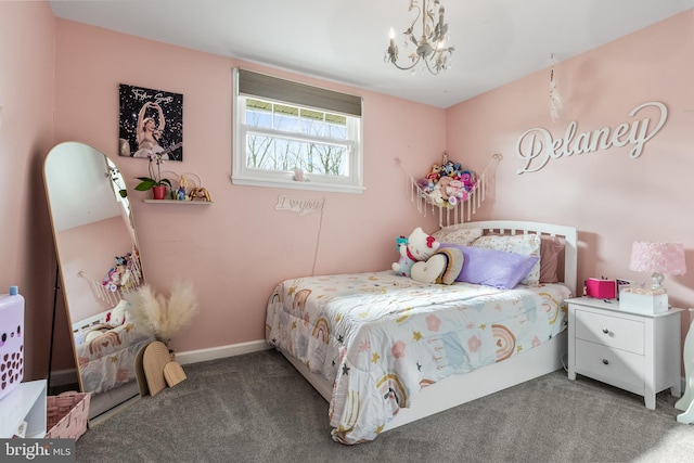 carpeted bedroom with a chandelier and baseboards