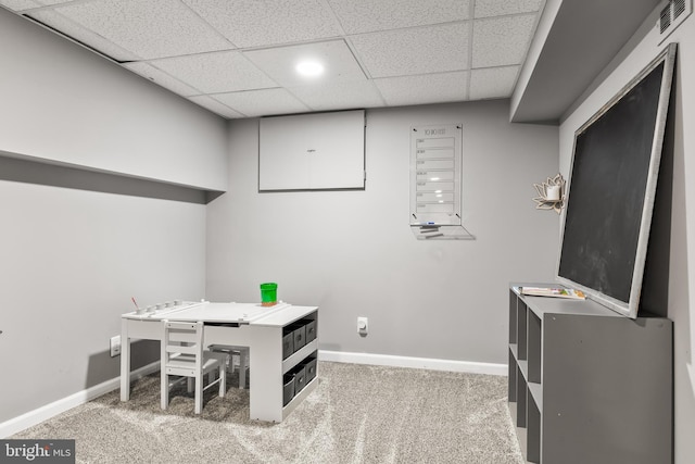 carpeted office with a drop ceiling, visible vents, and baseboards