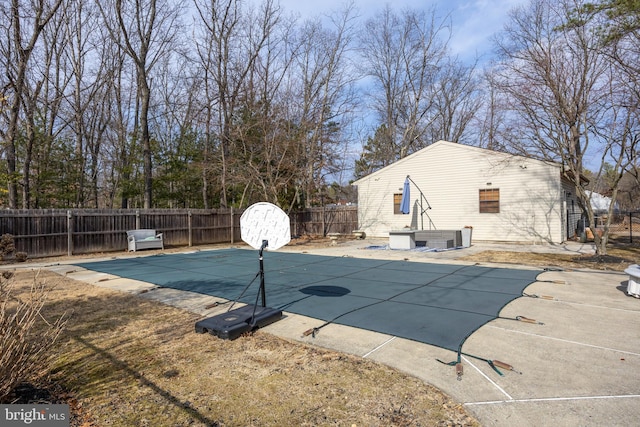 view of swimming pool featuring a patio, a fenced backyard, and a fenced in pool