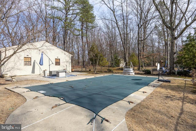 view of swimming pool featuring a fenced in pool, a patio, and fence