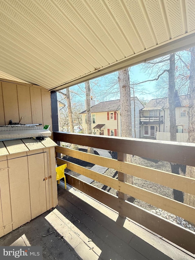 sunroom featuring a residential view