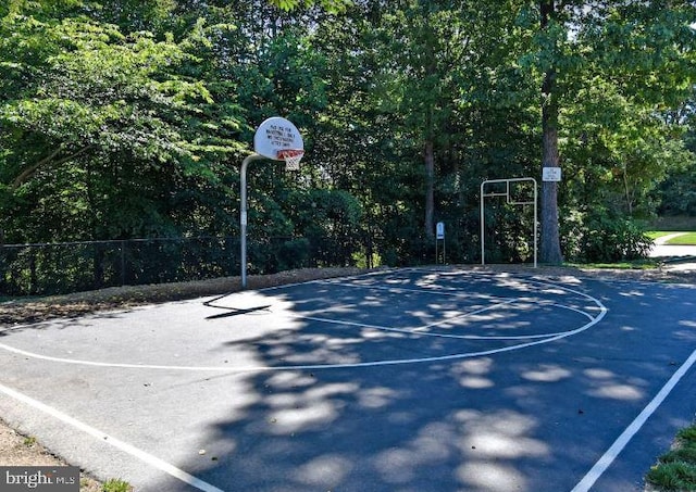 view of sport court featuring community basketball court and fence