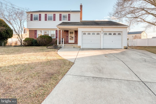 view of front of house featuring an attached garage, fence, a front lawn, and brick siding