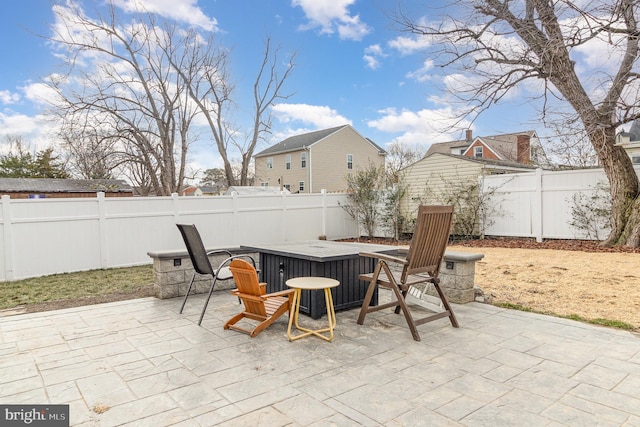 view of patio featuring a fenced backyard and outdoor dining area