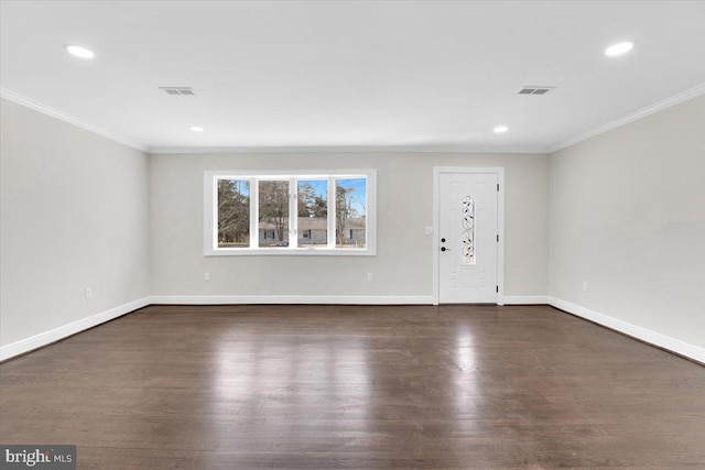 entryway with baseboards, visible vents, and wood finished floors