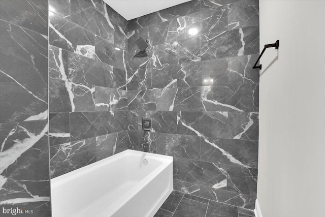 full bathroom featuring shower / bath combination and tile walls