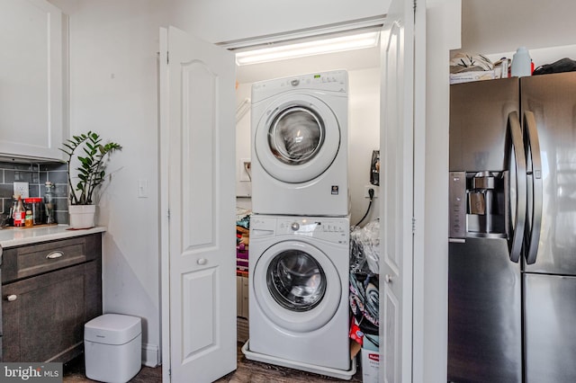 laundry room with laundry area and stacked washing maching and dryer