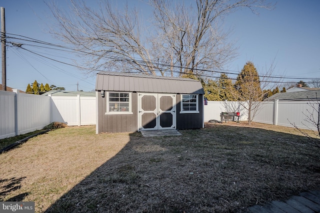 view of shed featuring a fenced backyard