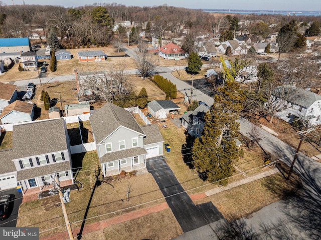 birds eye view of property with a residential view