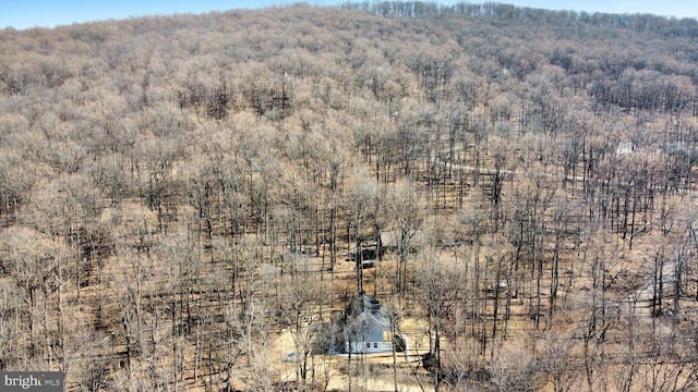 aerial view featuring a view of trees