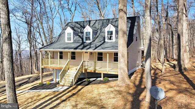 view of front of house with covered porch and stairway