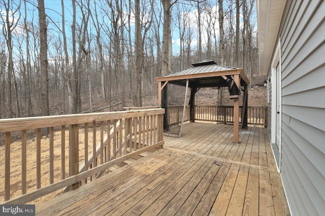 wooden deck featuring a gazebo