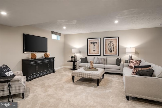 living room with recessed lighting, light colored carpet, and baseboards